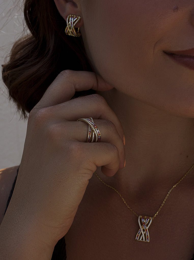 Gold-plated silver crossover ring with multi-colored stones
