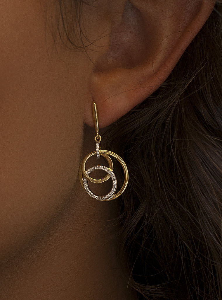 Two-tone silver drop earrings with circular cubic zirconia design