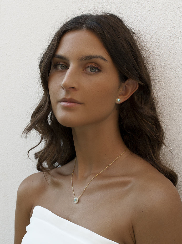 Gold stud earrings with mother-of-pearl and turquoise disc