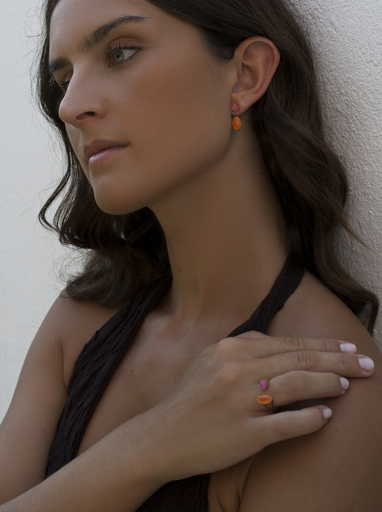 Open gold-tone silver ring with pink and orange stones