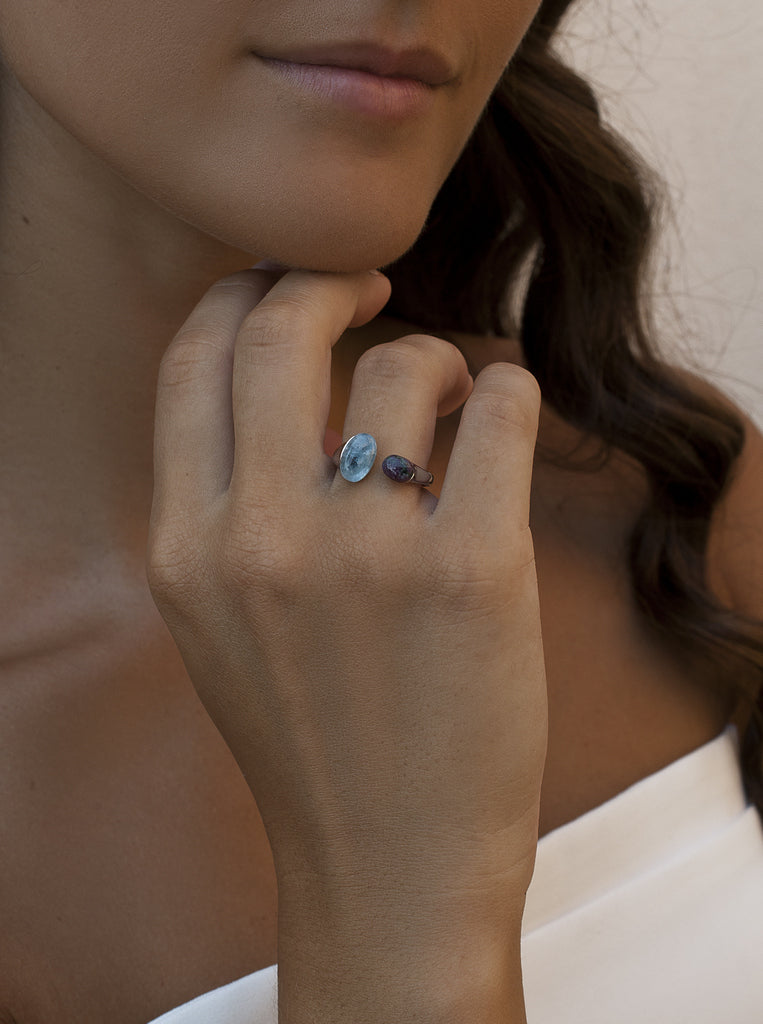 Open sterling silver ring with green and blue cabochon stones