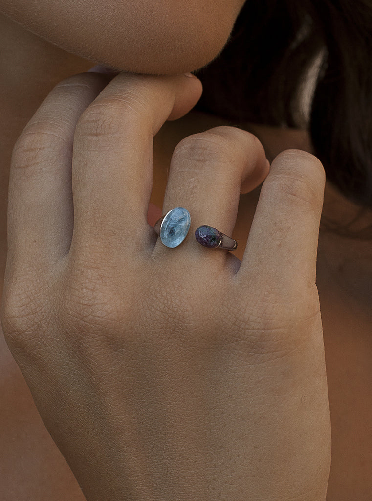 Open sterling silver ring with green and blue cabochon stones