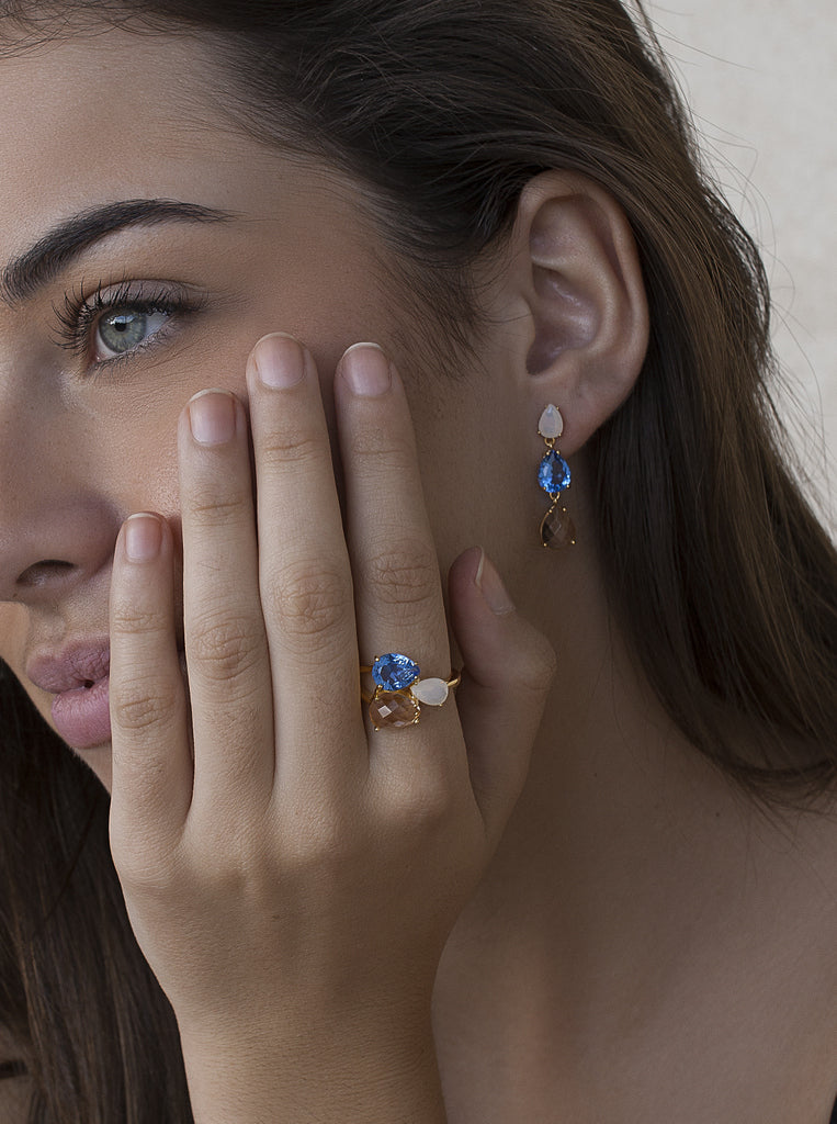 Long gold-plated silver earrings with multi-color blue, white, and champagne stones
