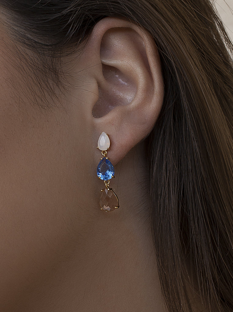 Long gold-plated silver earrings with multi-color blue, white, and champagne stones