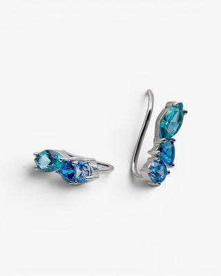 Pendientes trepadores de plata y piedras azules