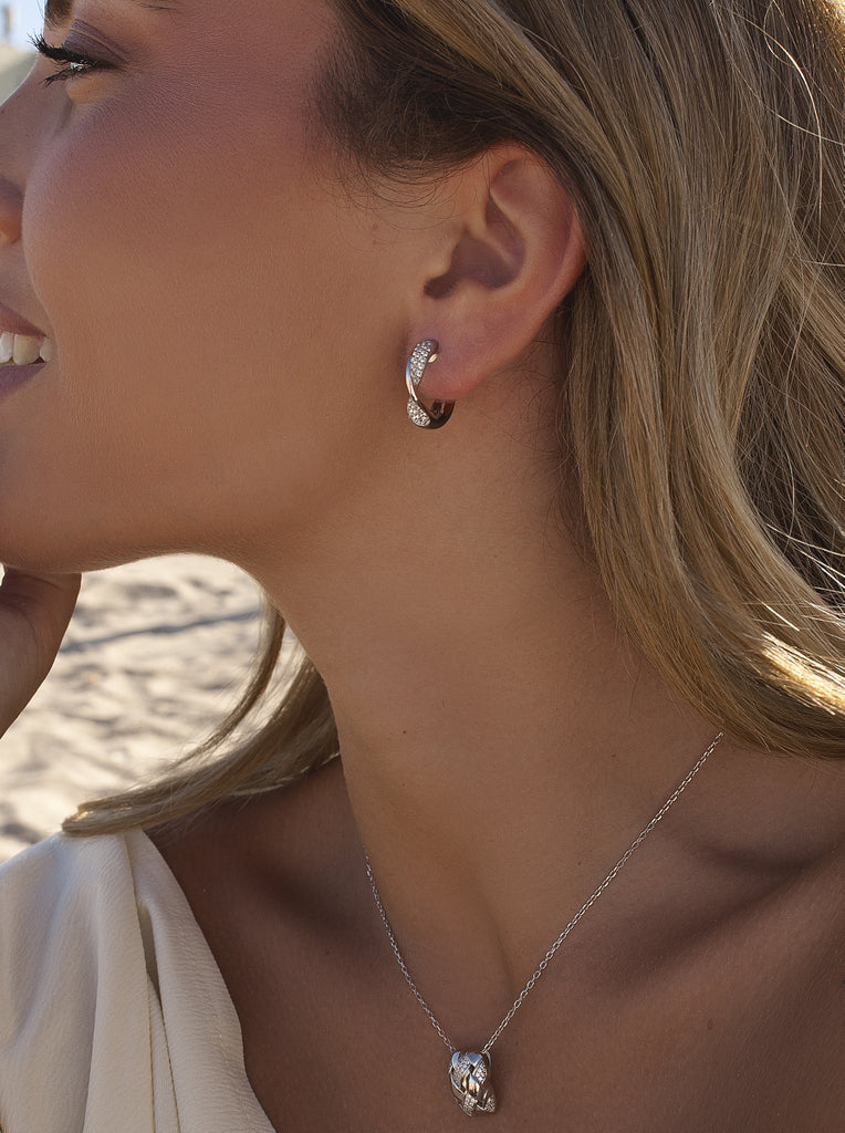 Silver earrings with cubic zirconia and a wavy design