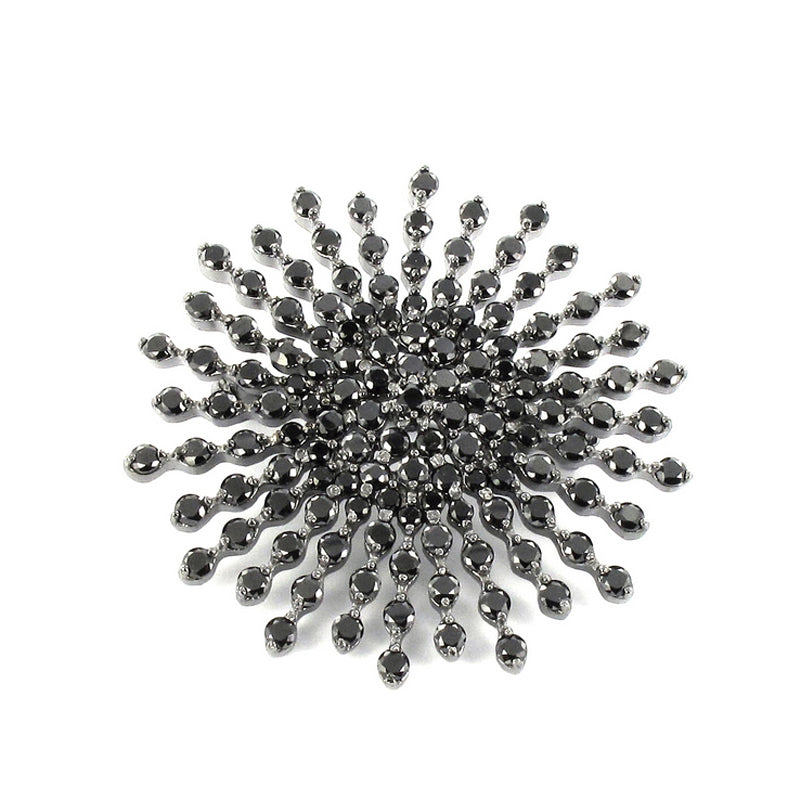 Silver brooch in black rhodium with star design and cubic zirconia