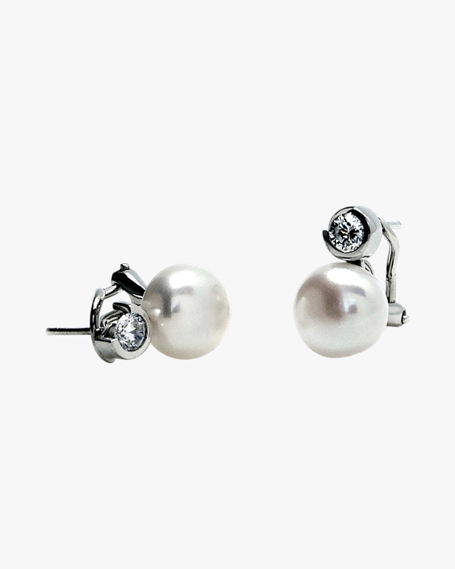 Pearl earrings in a toe-and-toe style with a pearl and round-cut cubic zirconia