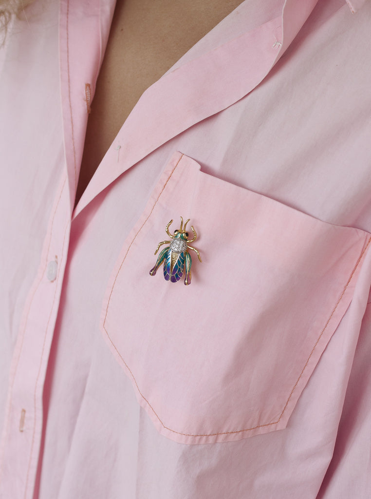 Broche con circonitas y esmalte en forma de grillo