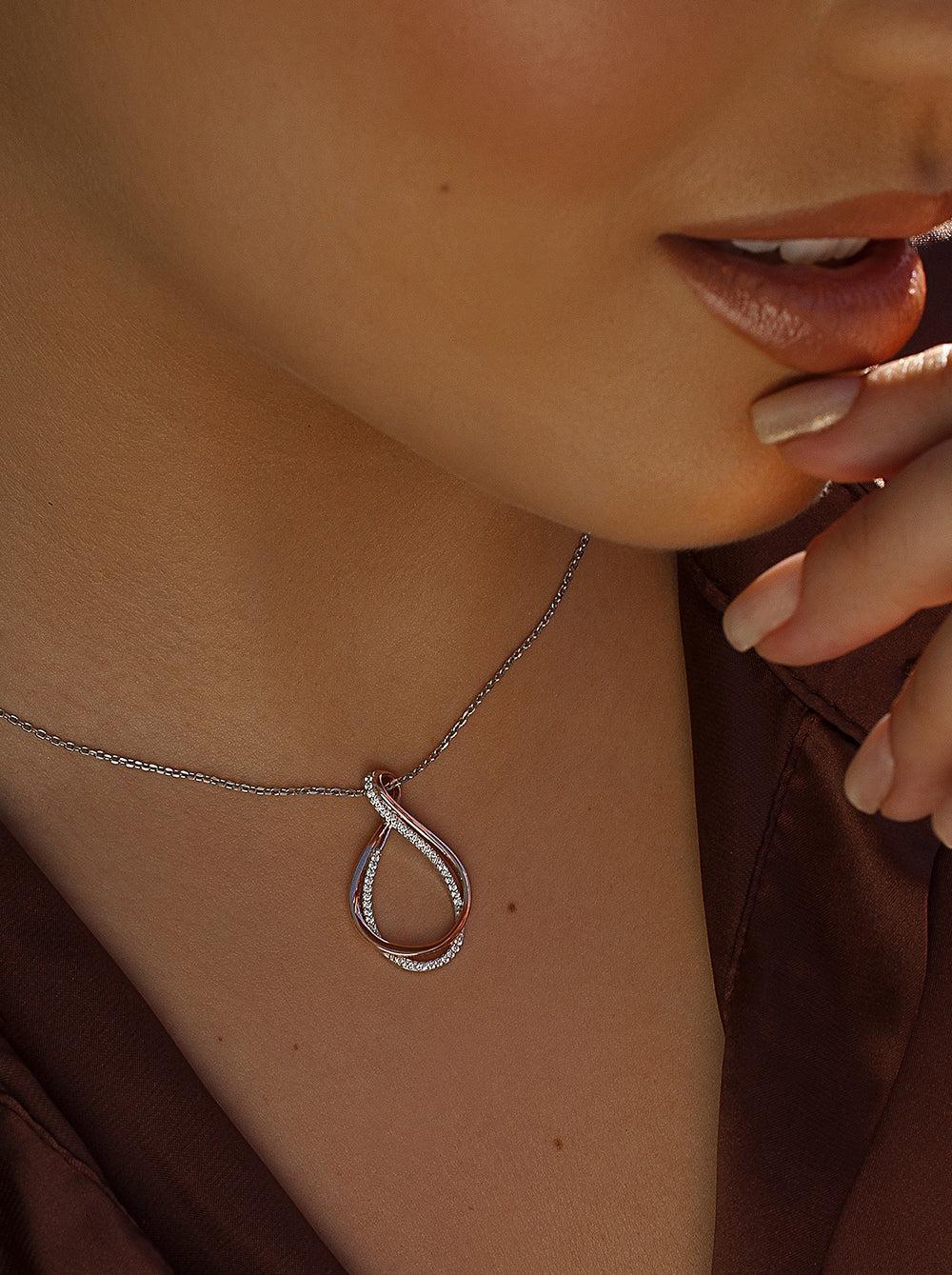 Colgantes bicolor de plata con circonita y curl bañado en oro rosa