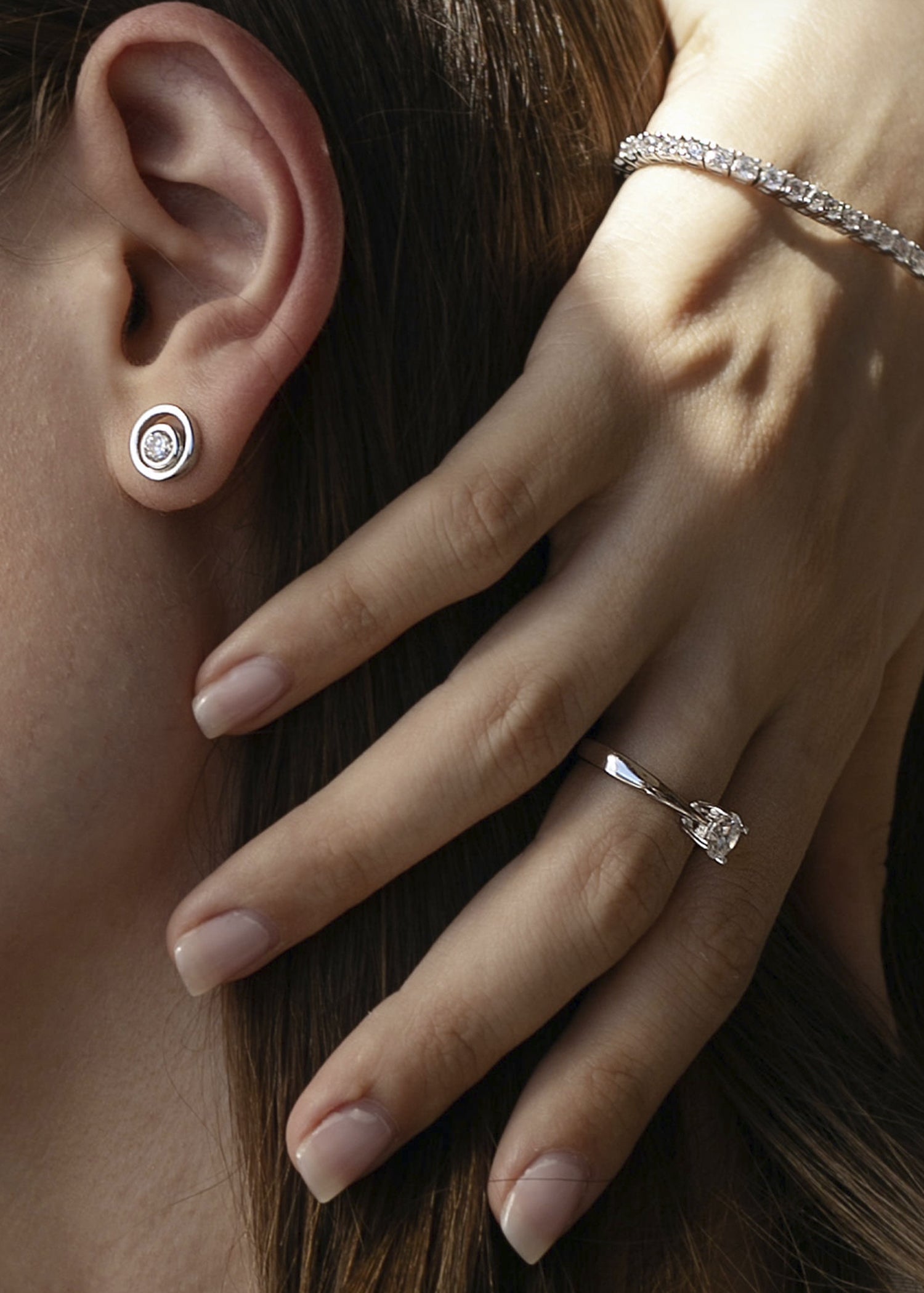 Double circle design stud earrings with central cubic zirconia