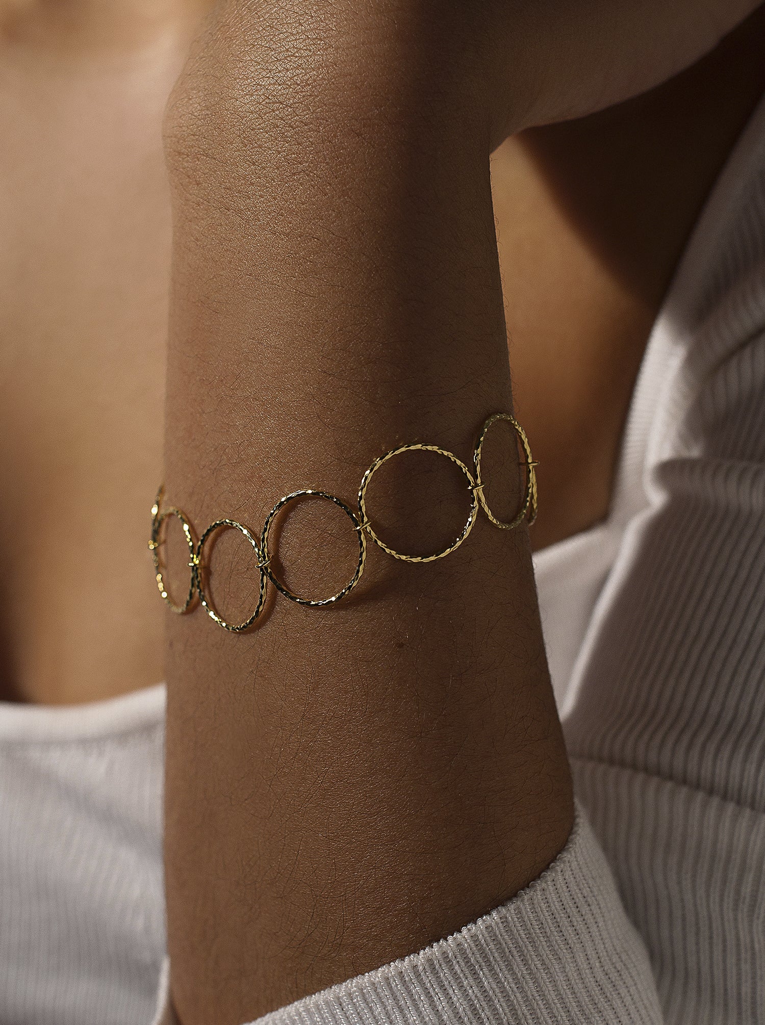 Gold-plated silver link bracelet with a boho style hoop design