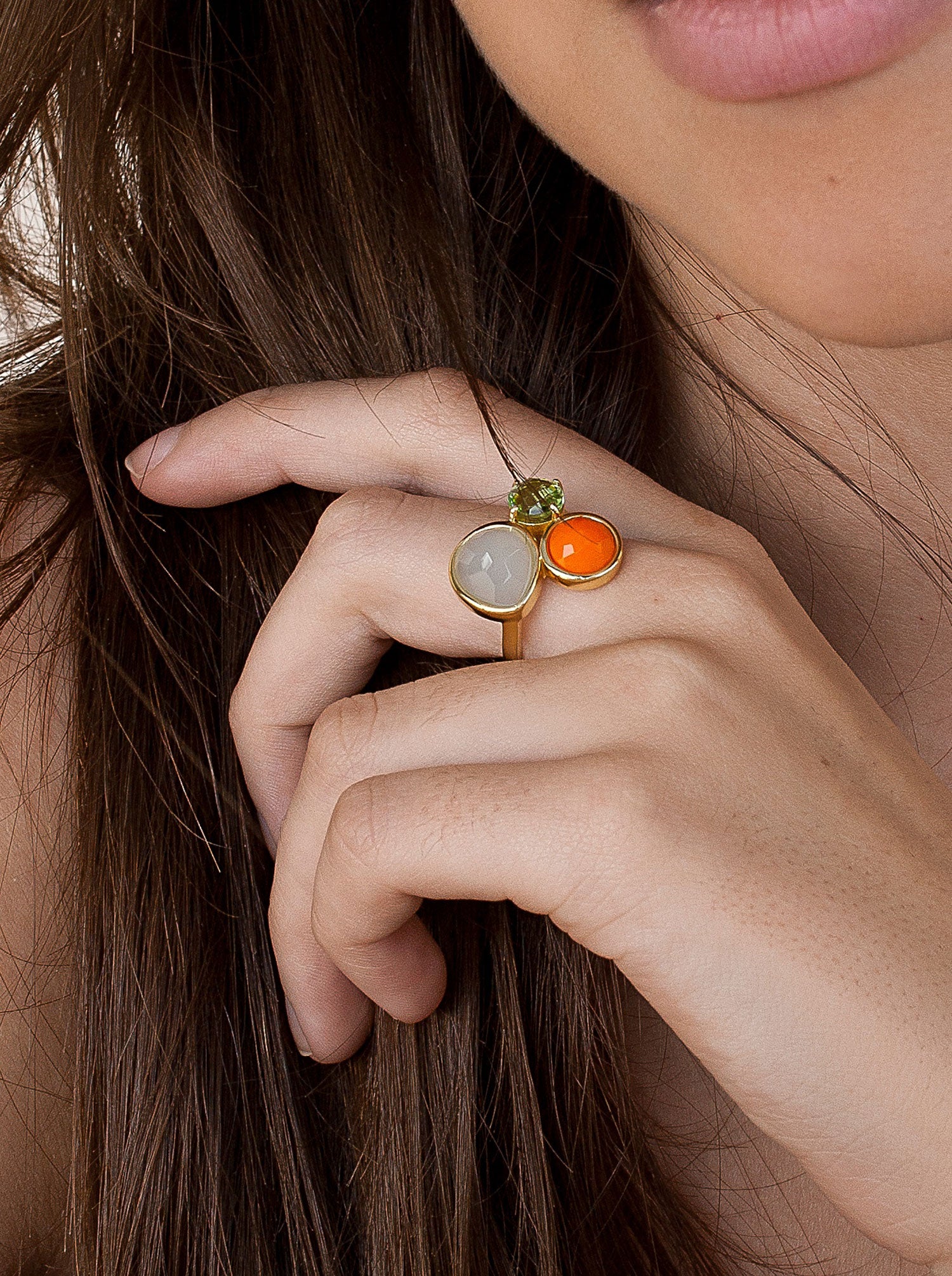 Gold-plated silver ring with three stones: green, orange, and white