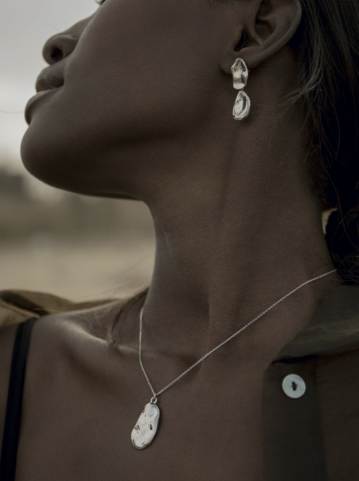 Original silver pendants with a regular concave design