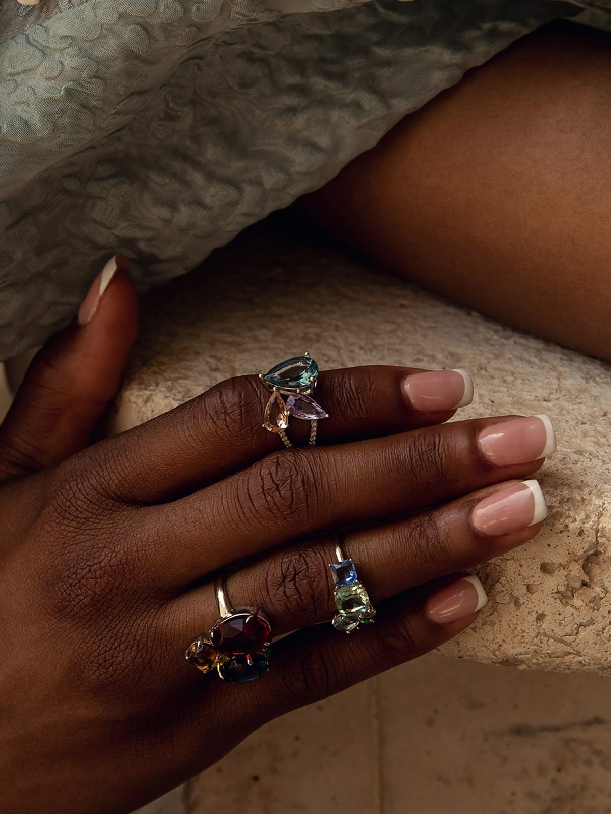 Rings with colored stones in mauve and blue tones
