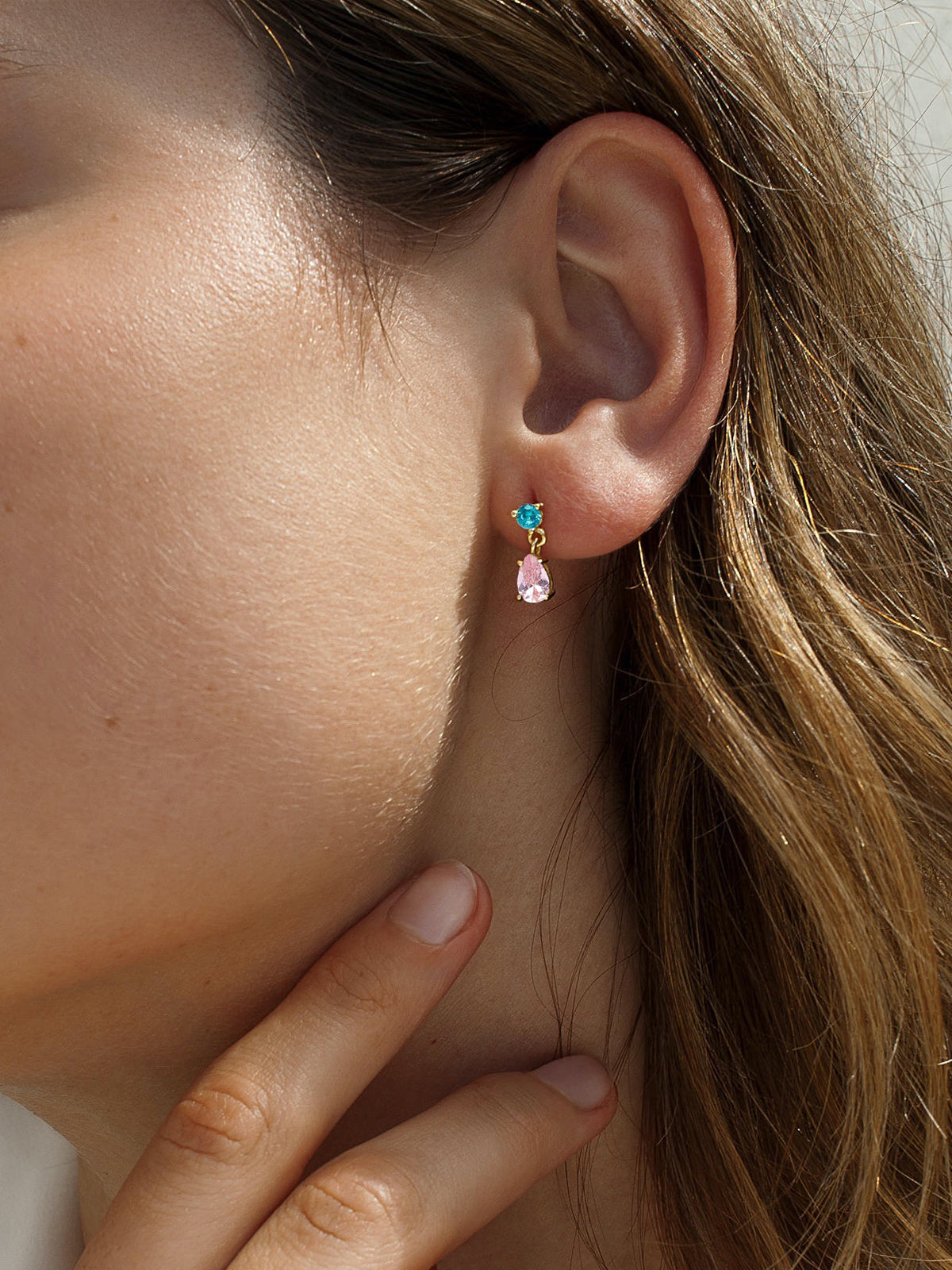 Small hoop earrings made of oval-cut adamantine quartz