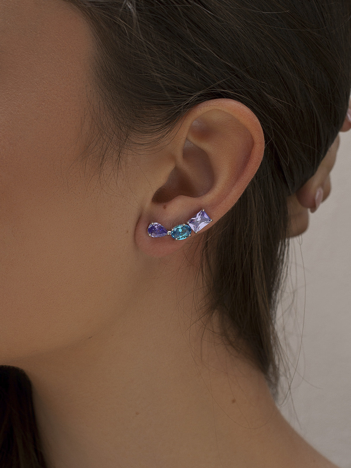 Silver climber earrings with lilac and petrol blue gems