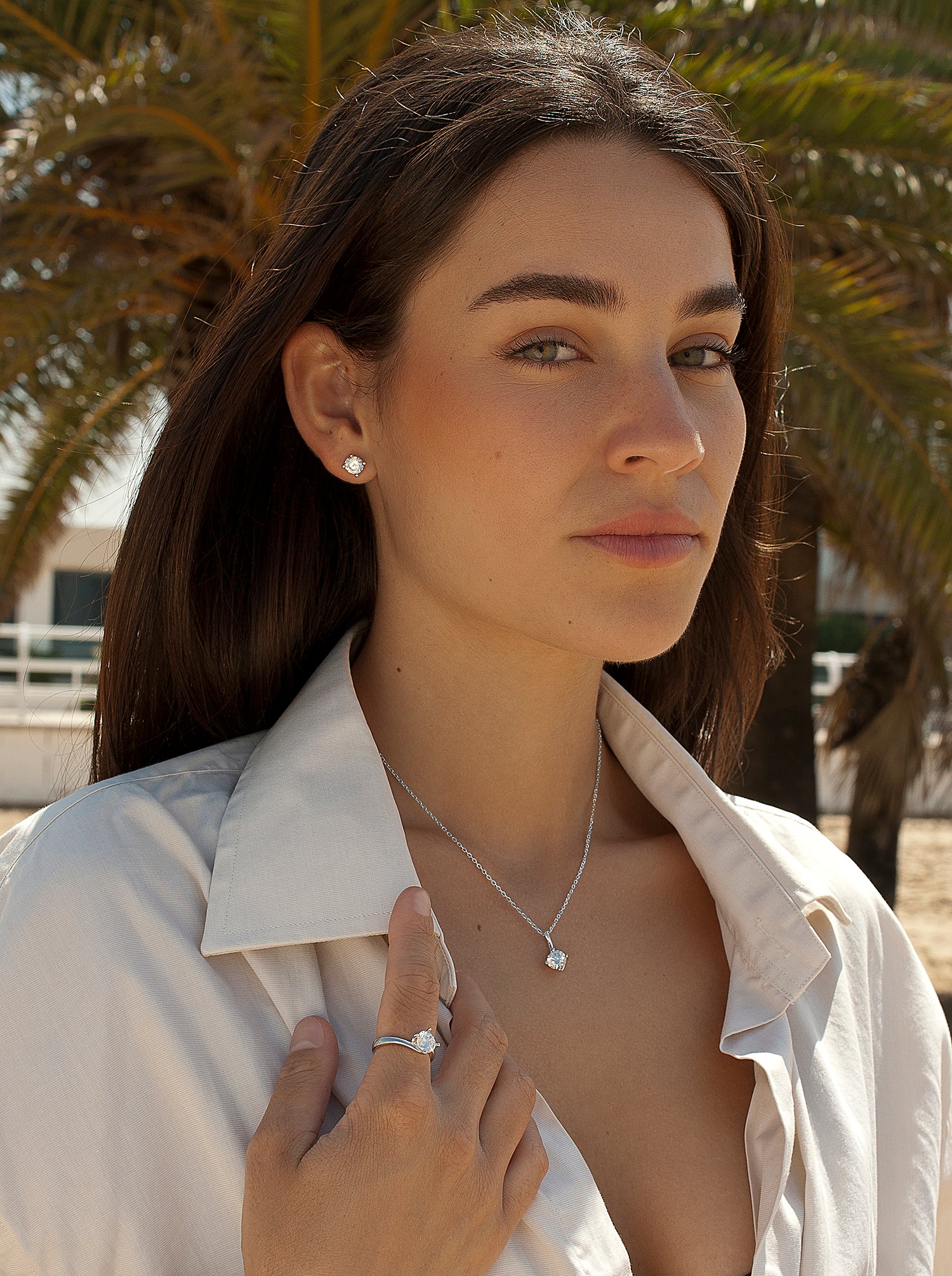 Small sparkling silver stud earrings with a stud and cubic zirconia design