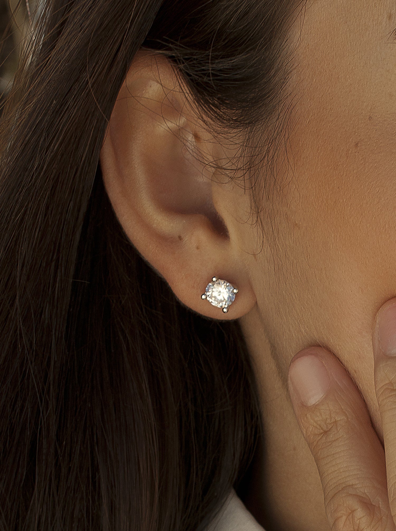 Small sparkling silver stud earrings with a stud and cubic zirconia design