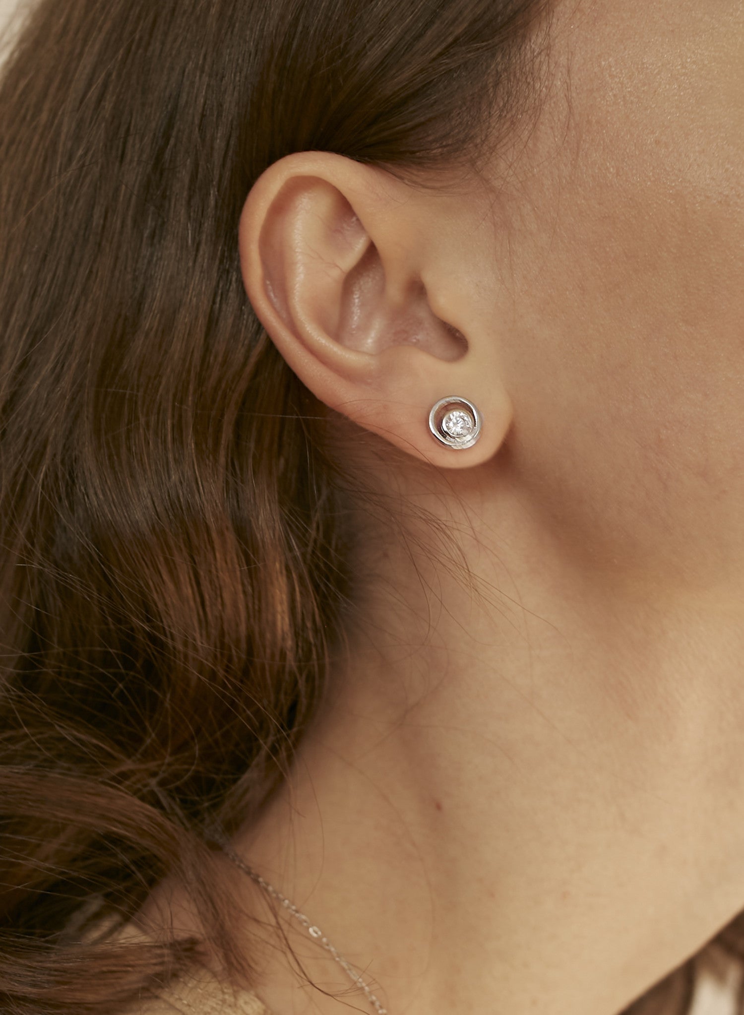 Helix design stud earrings with central cubic zirconia