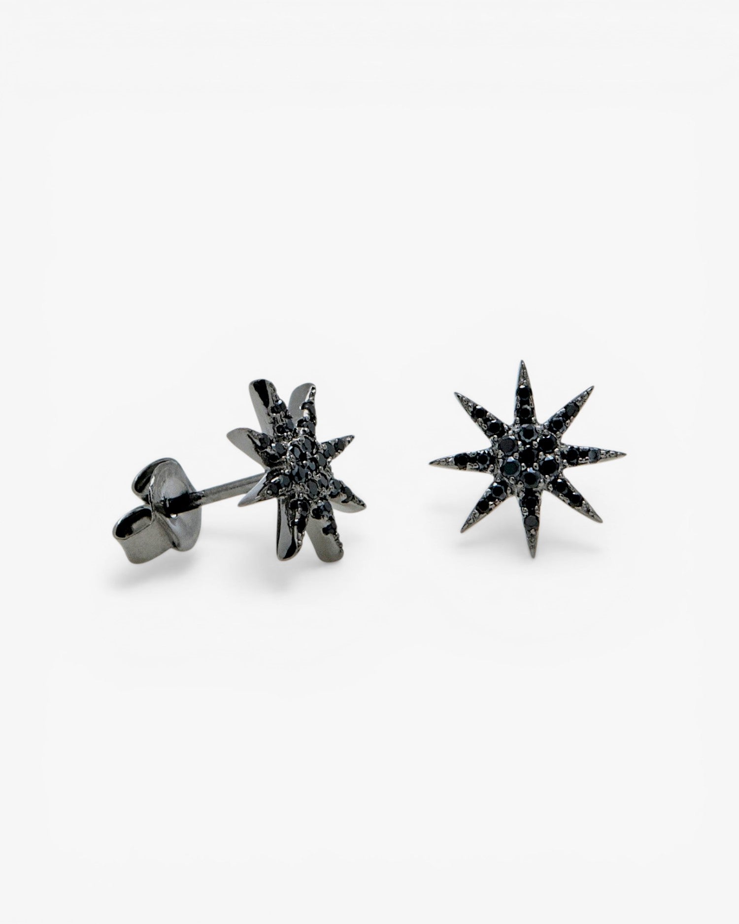 Small sparkling ruthenium-plated silver earrings with a polar star motif