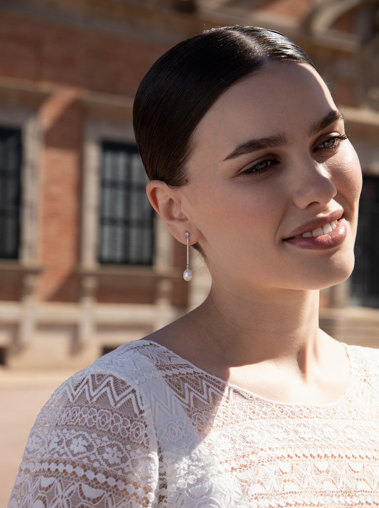 Long silver earrings with freshwater pearls that move and cubic zirconia detail