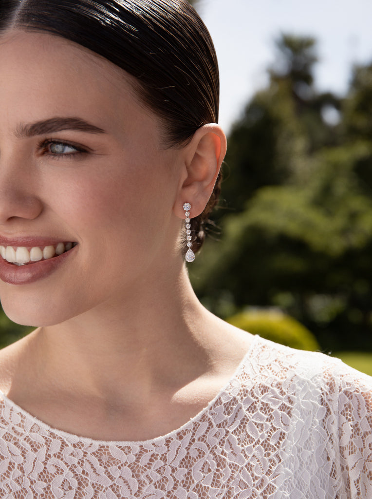 Long, linear-style silver bridal earrings with cubic zirconia