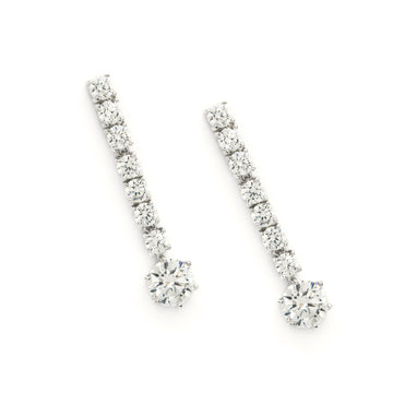 Long bridal earrings with a rigid, linear design.