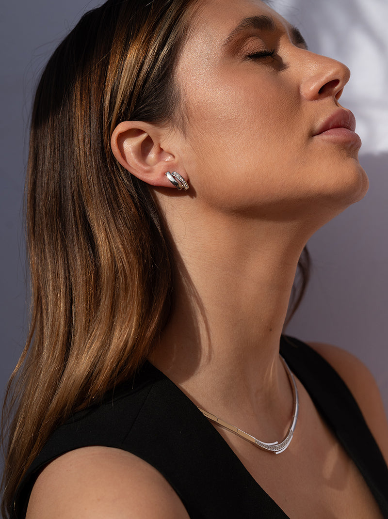 Silver party necklaces with unfinished side bands and a central cubic zirconia detail