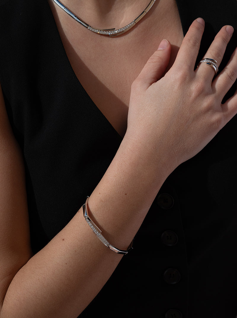 Sparkling silver bracelets with unfinished side bands and a central cubic zirconia detail