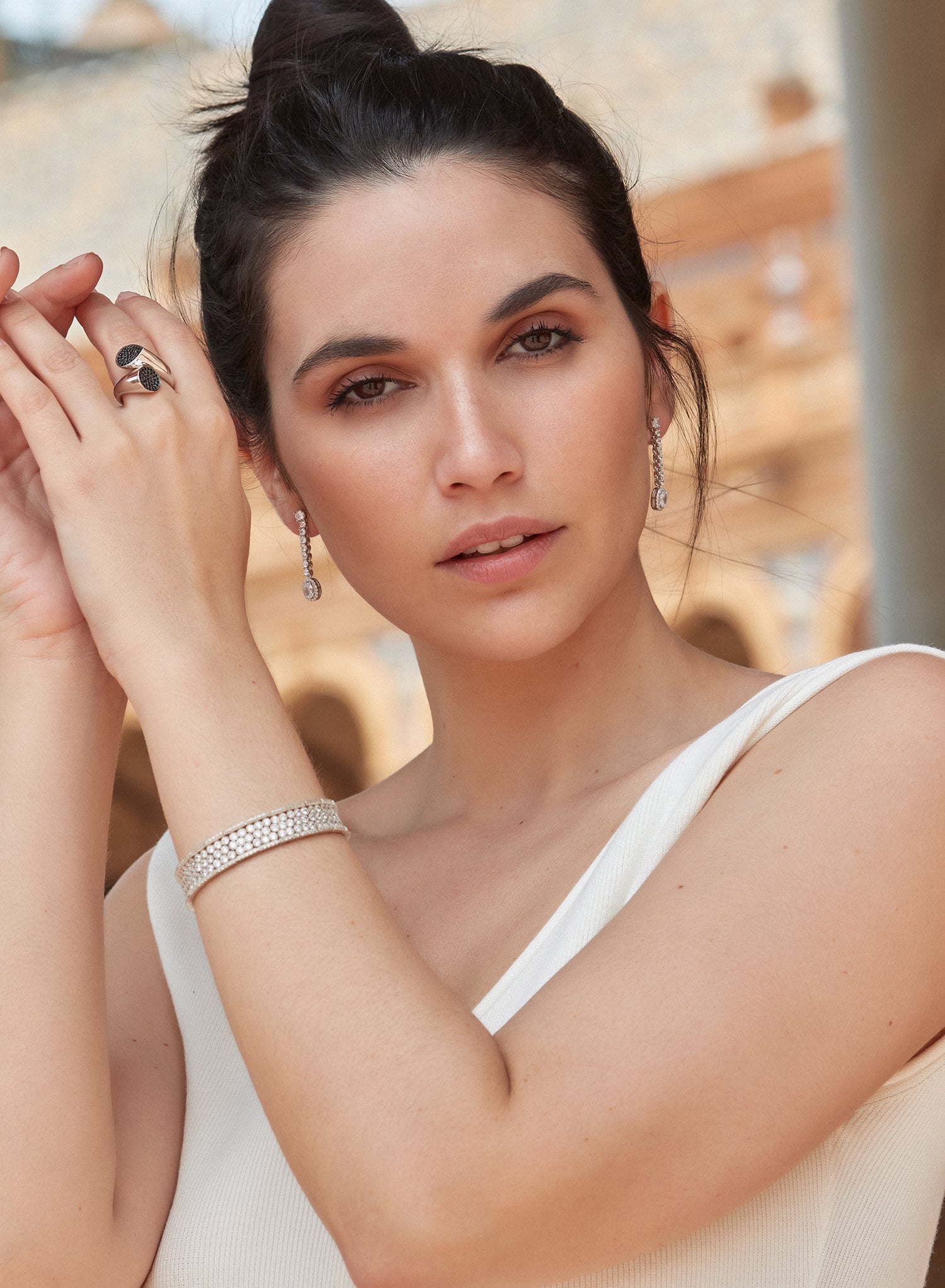 Long, shiny, finely designed silver earrings