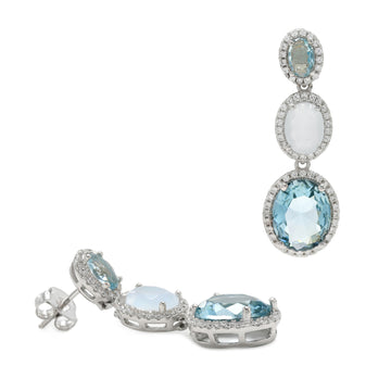 Long earrings with colorful stones in a circular design