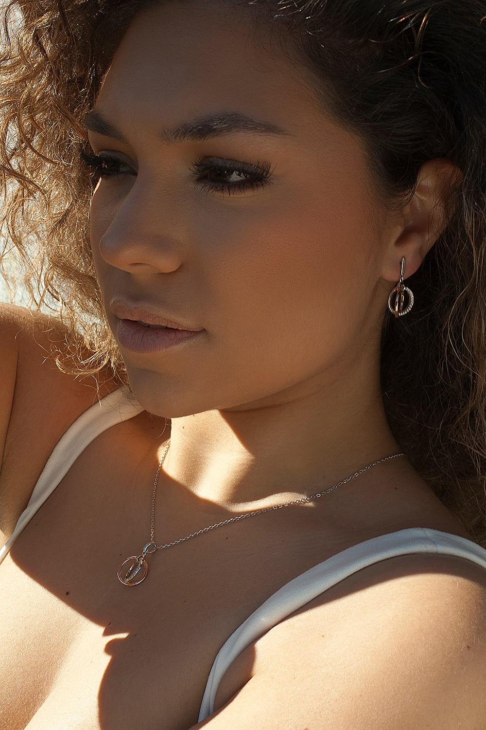 Two-tone silver and cubic zirconia dangling earrings with double hoop