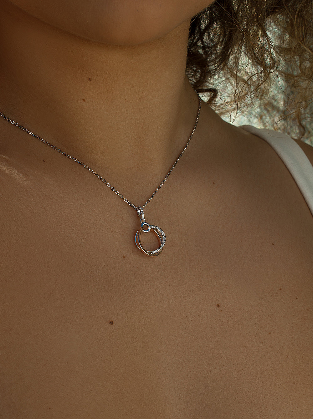 Pendants two tone silver design from double hoop and zirconia