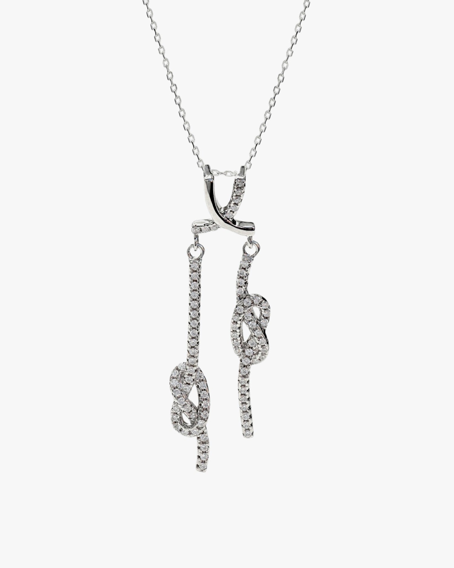 Original silver necklaces with double knot design and cubic zirconia.