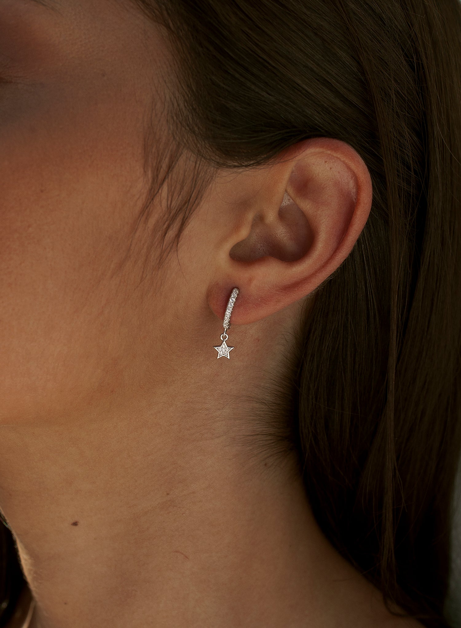 Hoop earrings with silver pendants and star charm with cubic zirconia