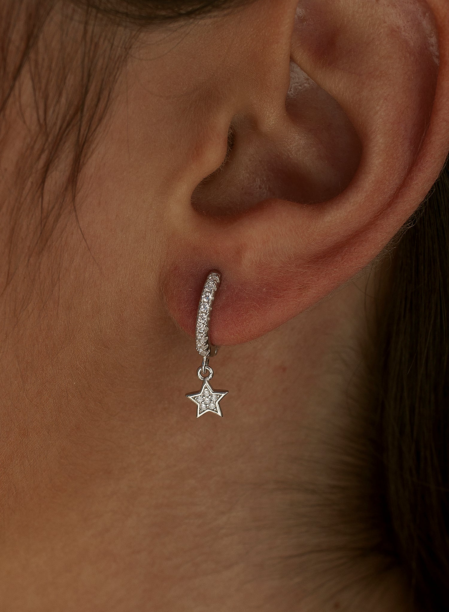 Hoop earrings with silver pendants and star charm with cubic zirconia