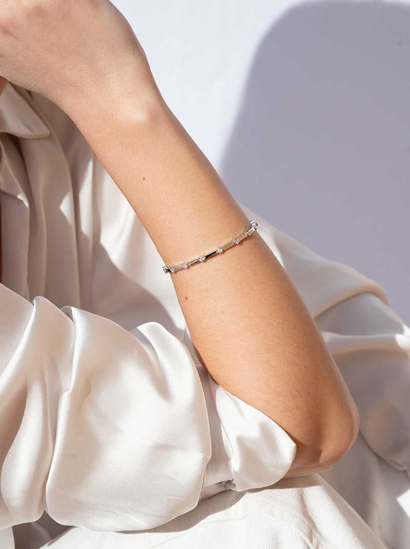 Thin silver bracelets with multiple cubic zirconia designs