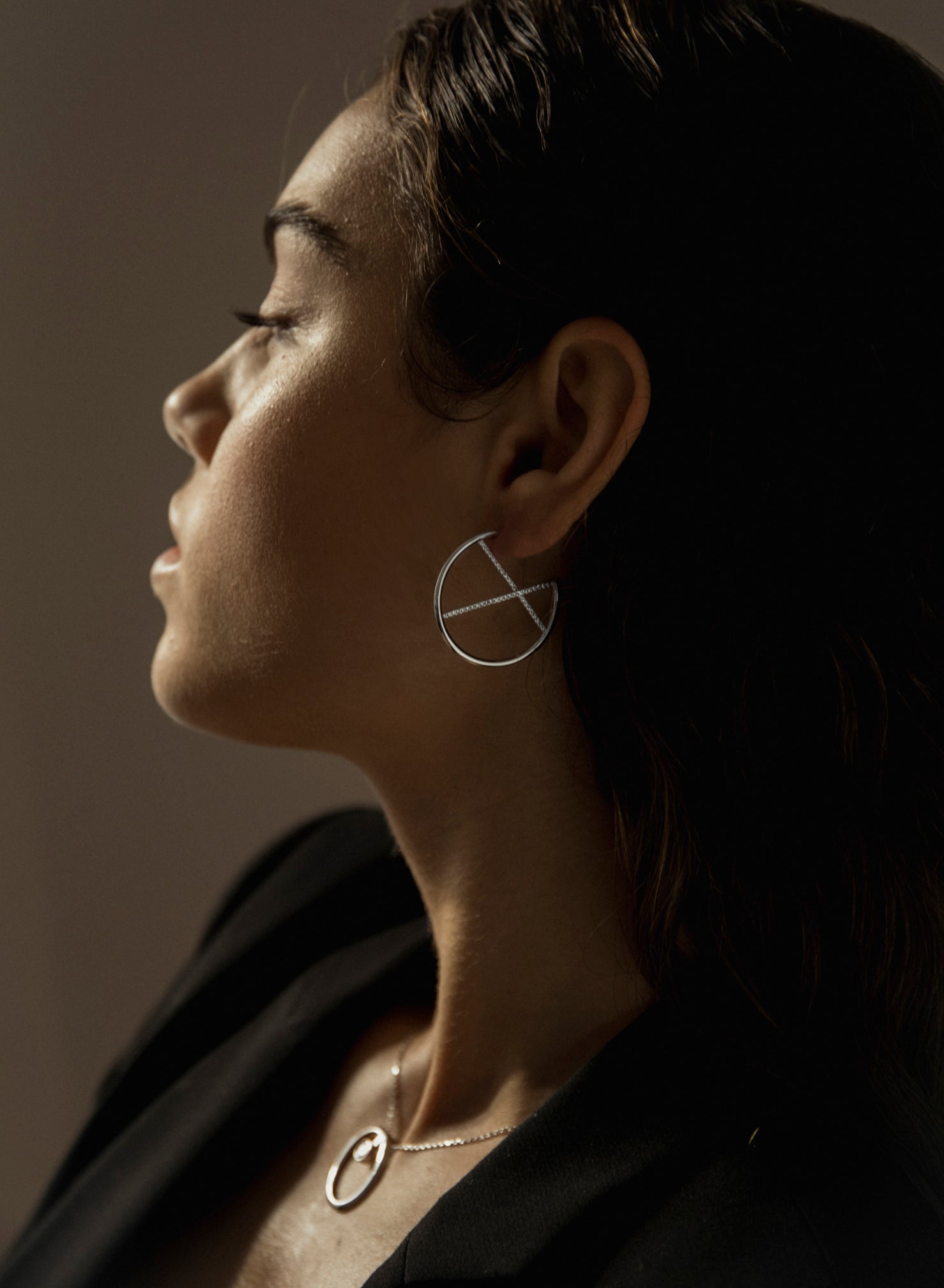 Original hoop earrings with crossed cubic zirconia channel design