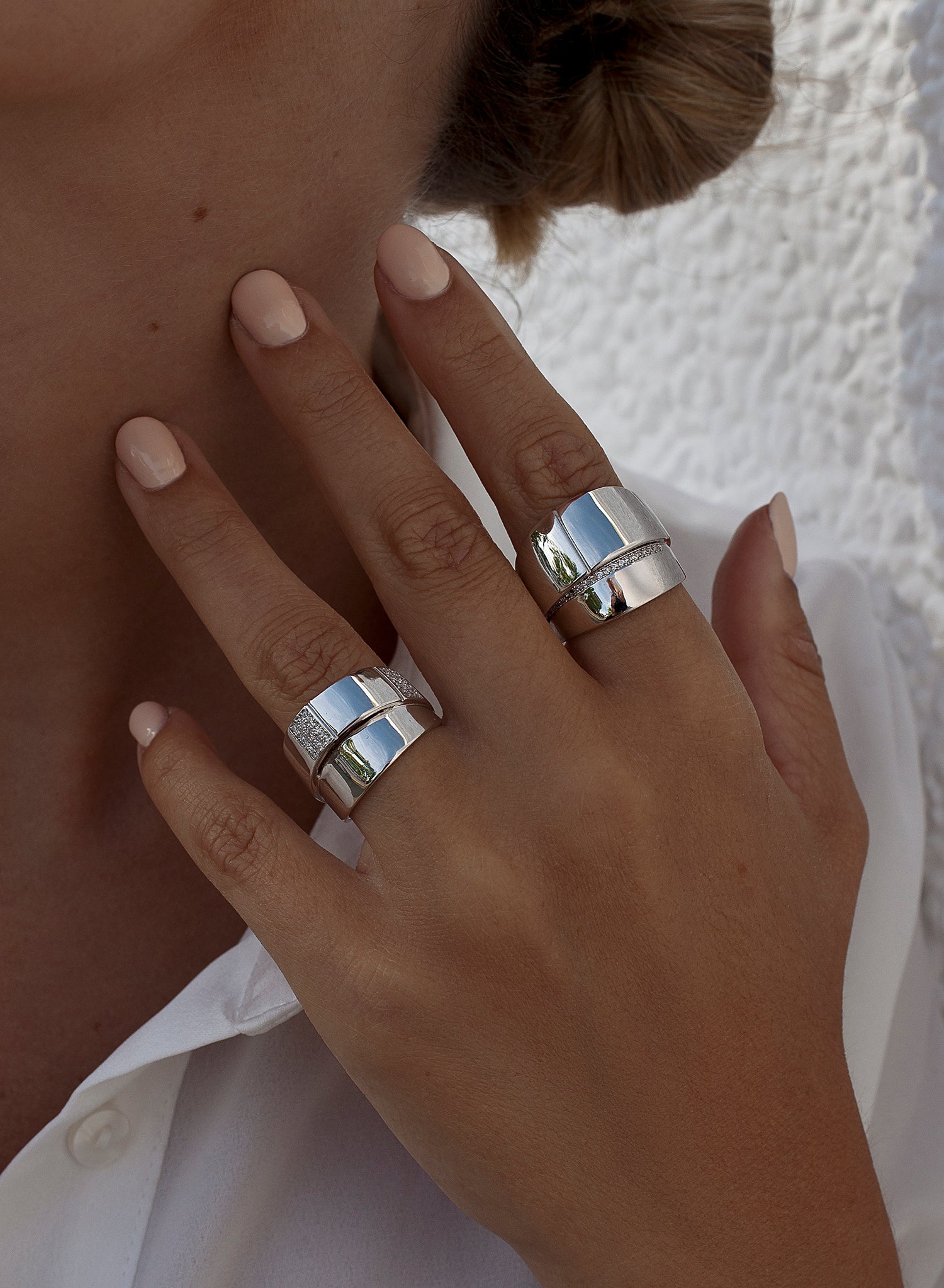 Wide rings with a double-level design and cubic zirconia details
