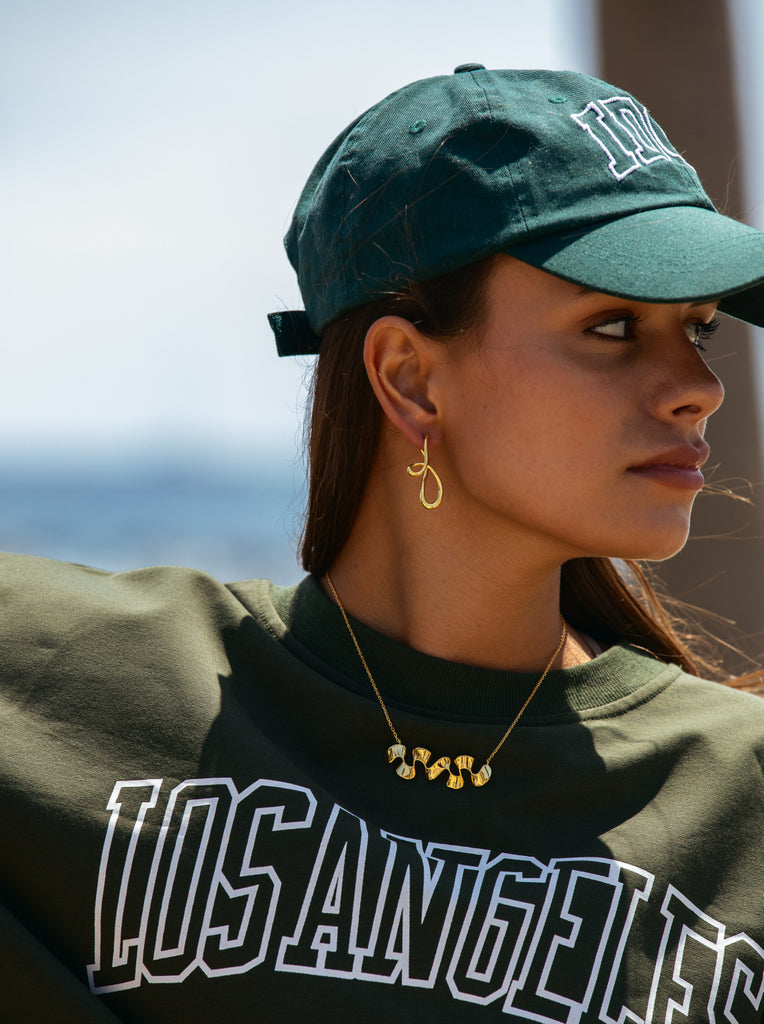 Pendientes originales en plata bañada en oro estilo liquido entrelazado