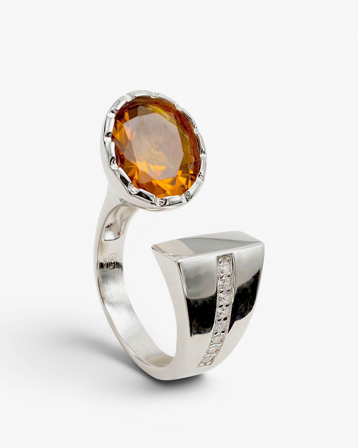 Large open design rings with bronze-tone stone
