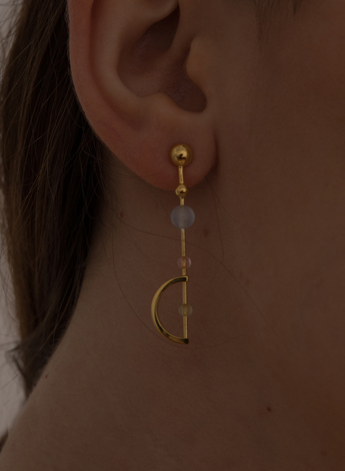 Original silver earrings with a linear design and colored stones.