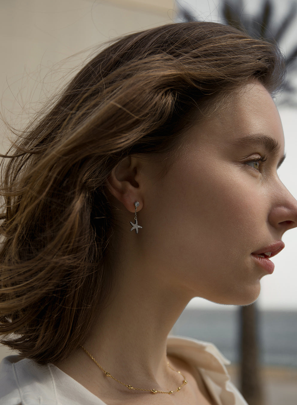 Segundo pendiente de plata con charm de estrella de mar