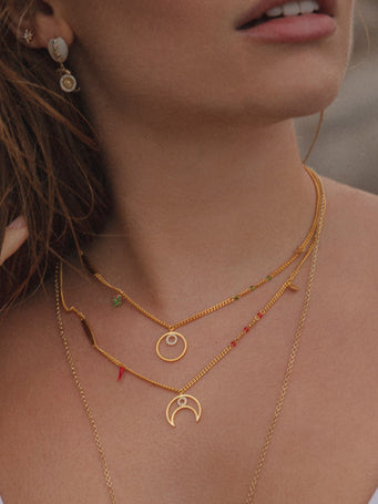 Necklaces with silver-plated pendants and assorted charm designs