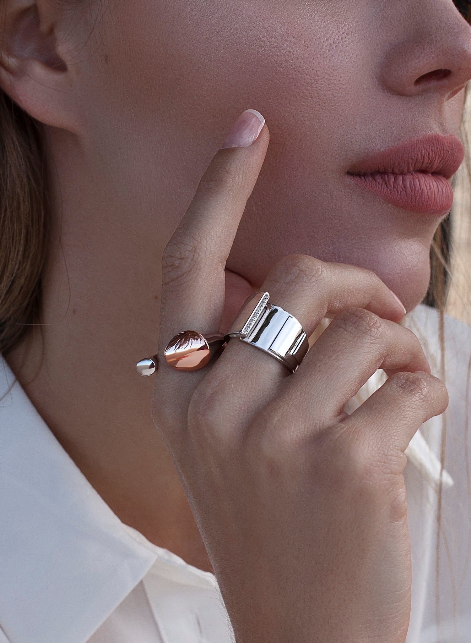 Wide rings with overlapping design and cubic zirconia detail