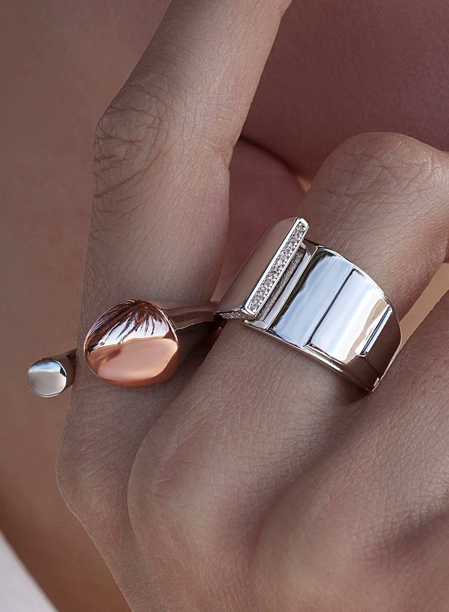 Wide rings with overlapping design and cubic zirconia detail