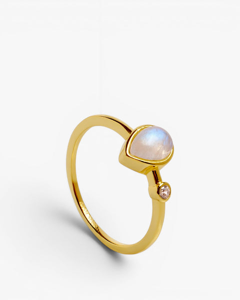 Thin silver rings with teardrop motif and moonstone