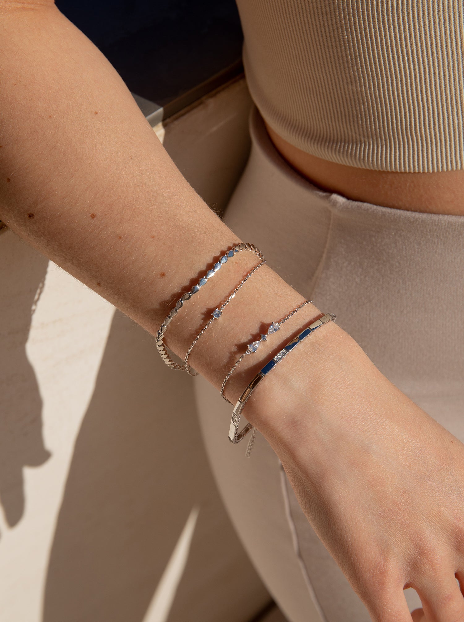 Thin silver bracelets with a minimalist double design