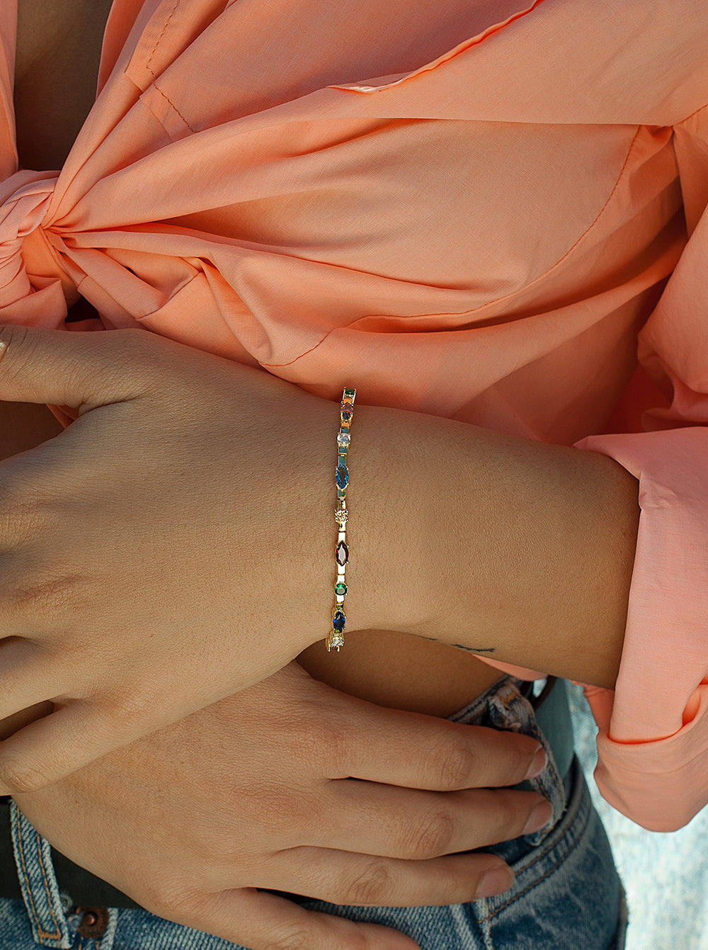 Bracelets with multicolored silver stones arranged linearly